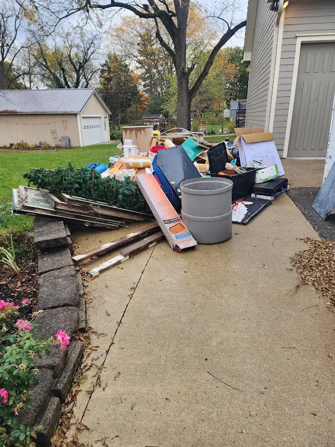 Dumpster being loaded with debris for Roofing Dumpster Rental in South Hanover